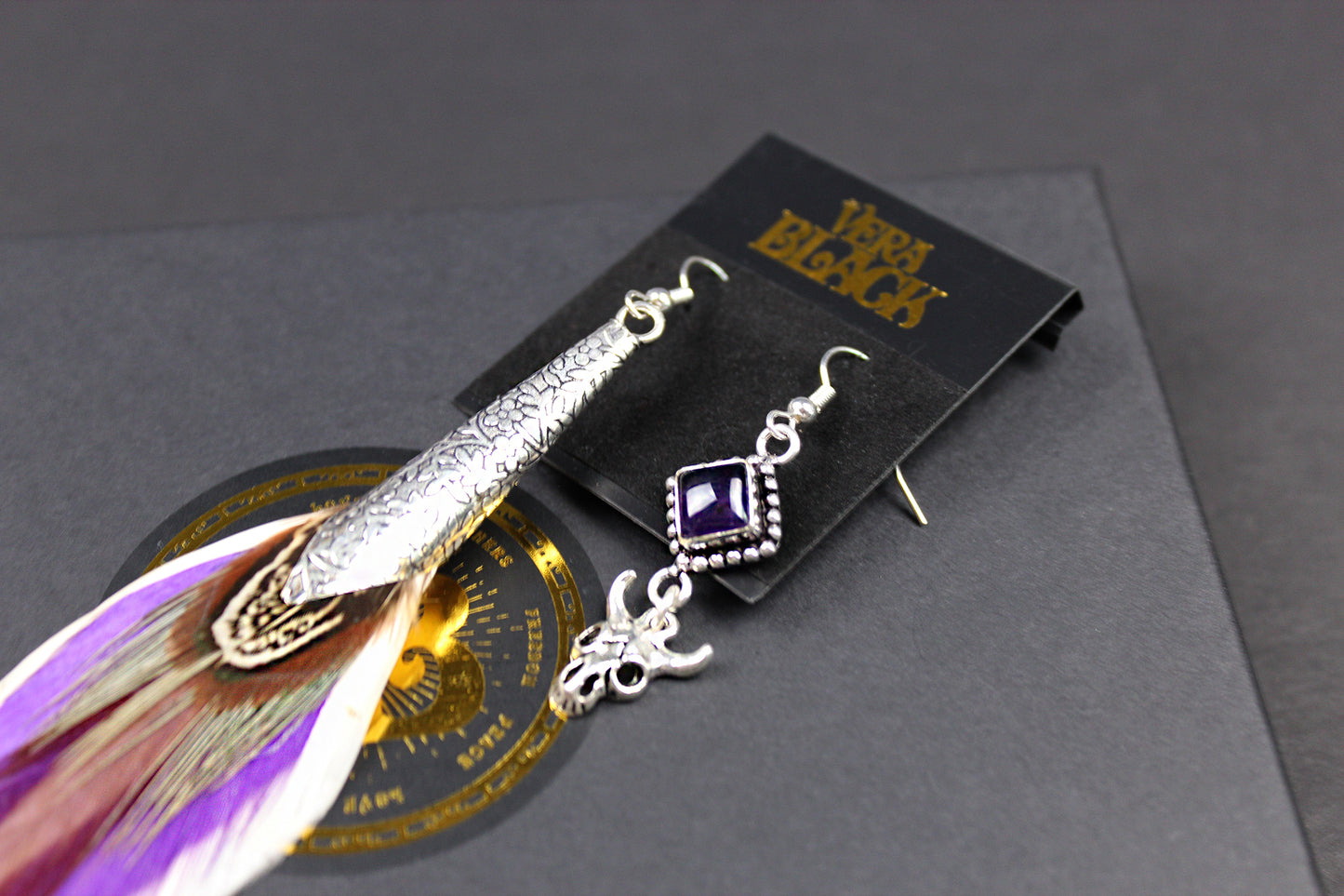 The Harlequin Earring Set - White and purple natural feather earrings with amethyst stone, asymmetrical pair of boho rock n roll earrings