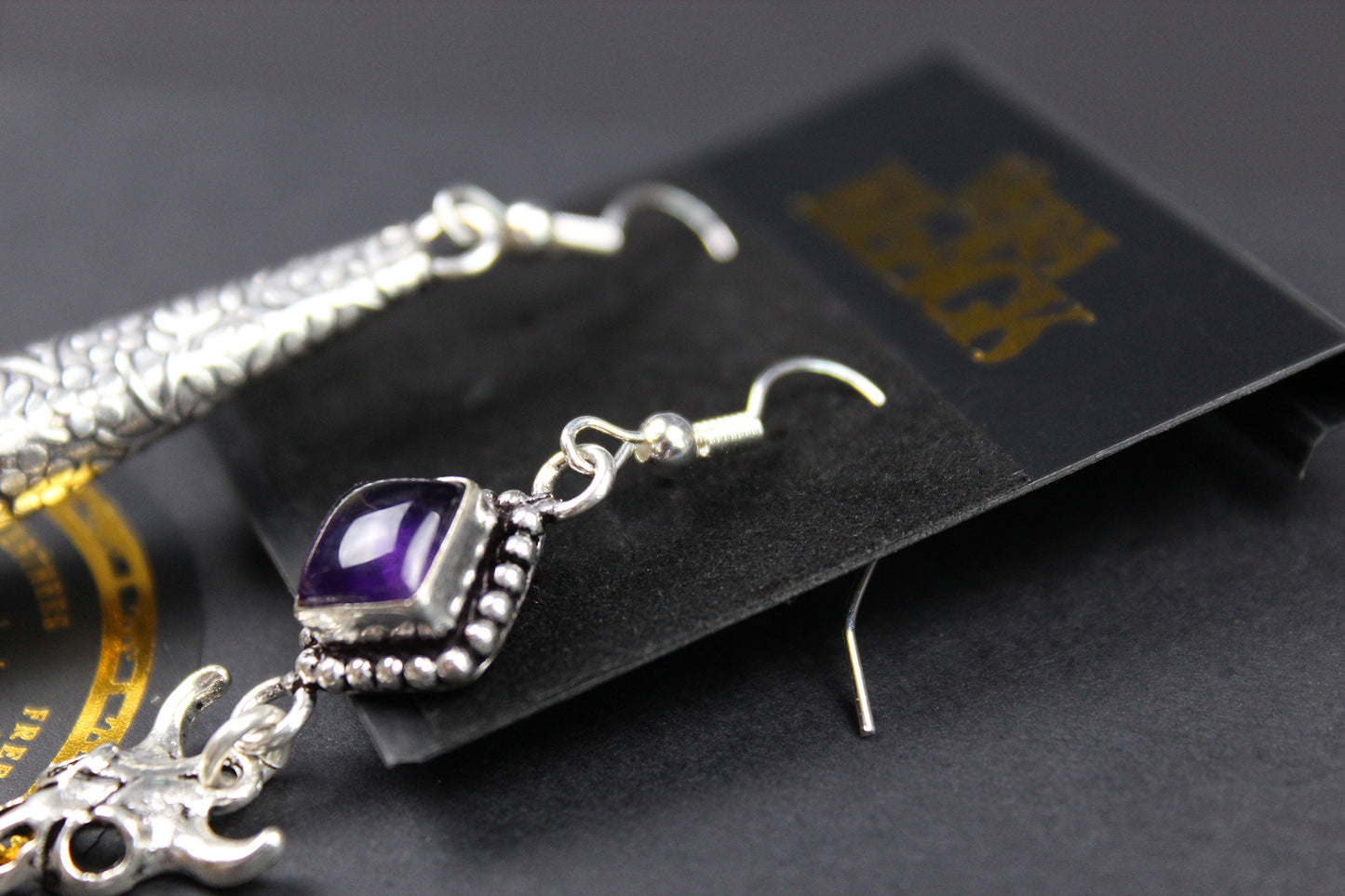 The Harlequin Earring Set - White and purple natural feather earrings with amethyst stone, asymmetrical pair of boho rock n roll earrings