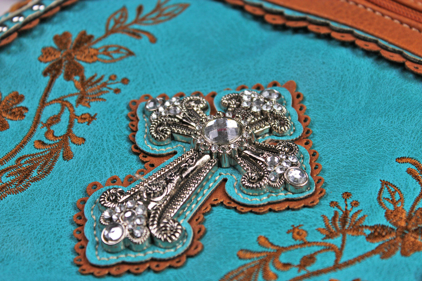 The Montana Shoulder Bag - turquoise & brown western cowgirl style bag with intricate detailing and cross motif with an internal zip pocket