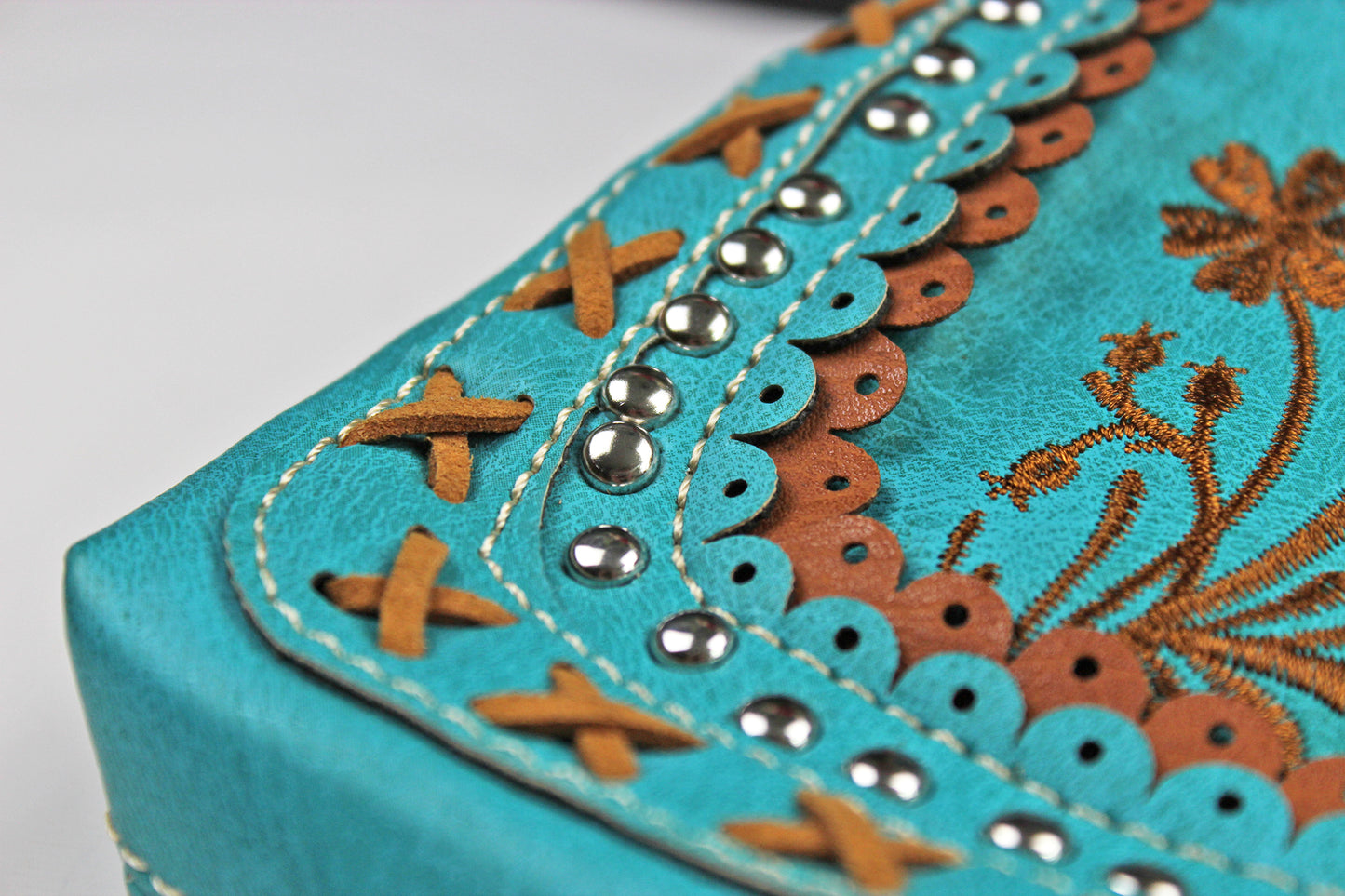 The Montana Shoulder Bag - turquoise & brown western cowgirl style bag with intricate detailing and cross motif with an internal zip pocket