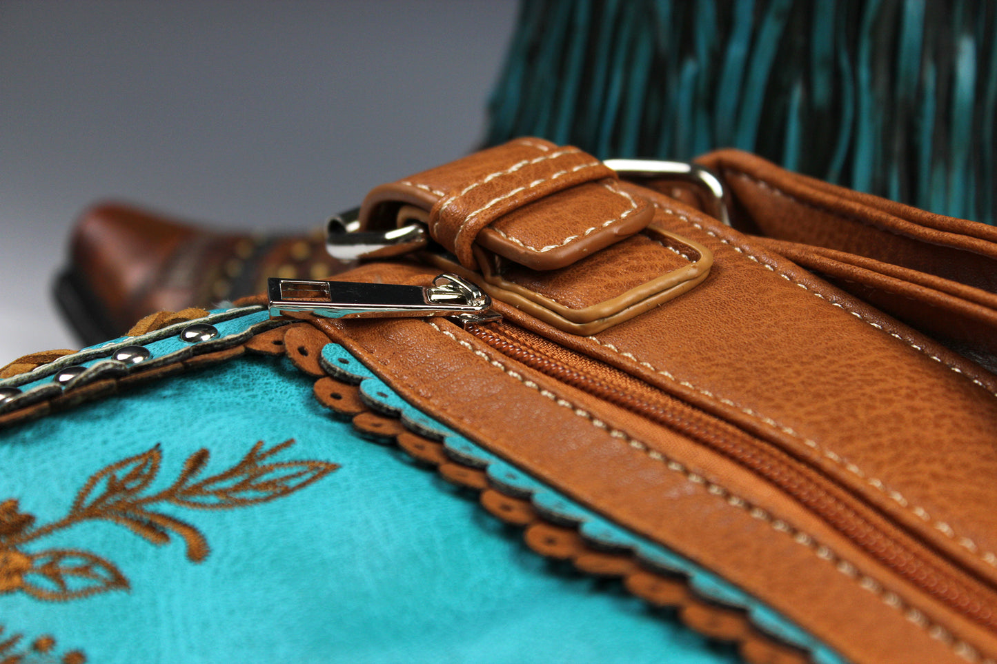 The Montana Shoulder Bag - turquoise & brown western cowgirl style bag with intricate detailing and cross motif with an internal zip pocket
