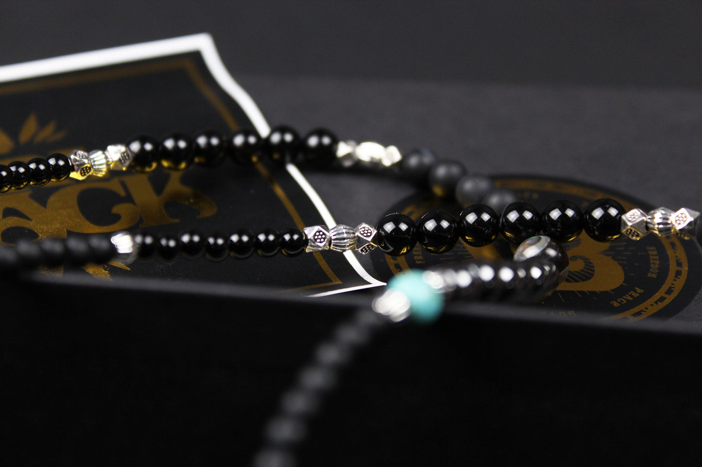 The Buffalo Smoke Necklace : Unisex Beaded Necklace Detailed with hematite, howlite, matte agate, lava stone, black onyx and silver beading, all of this leading to a very cool ram's head pendant.