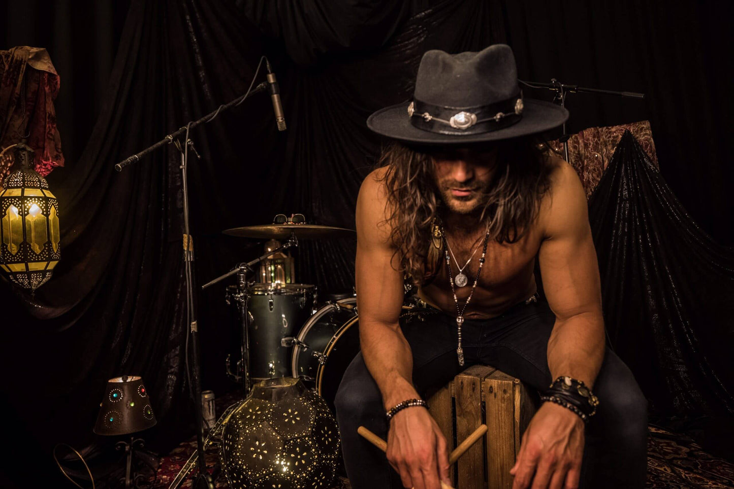 The Hombre Black Fedora Hat. Black wool felt fedora hat with a black leather look hat band with silver conchos and wild turkey with pheasant feather. rock n roll fedora hat.