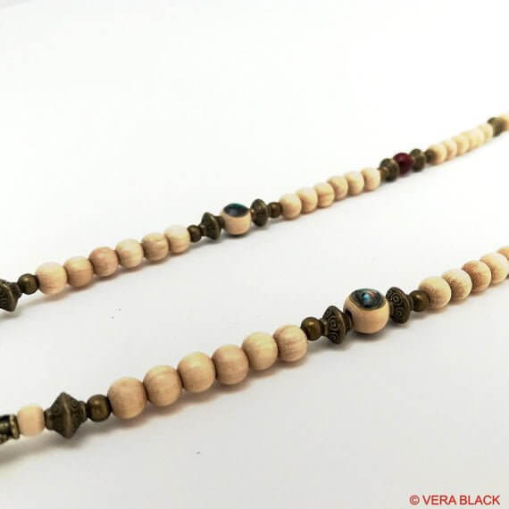 long beaded necklace with antique bronze detailing and wood beading