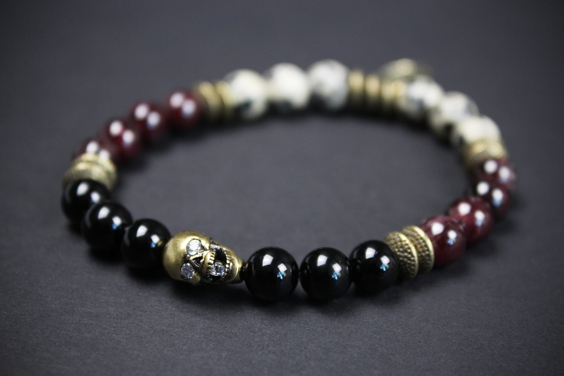 The Snake Eyes Bracelet - Black Onyx Red Garnet Dalmation Jasper Bronze Detailing Rock n Roll Pirate Style Unisex For Men And Women