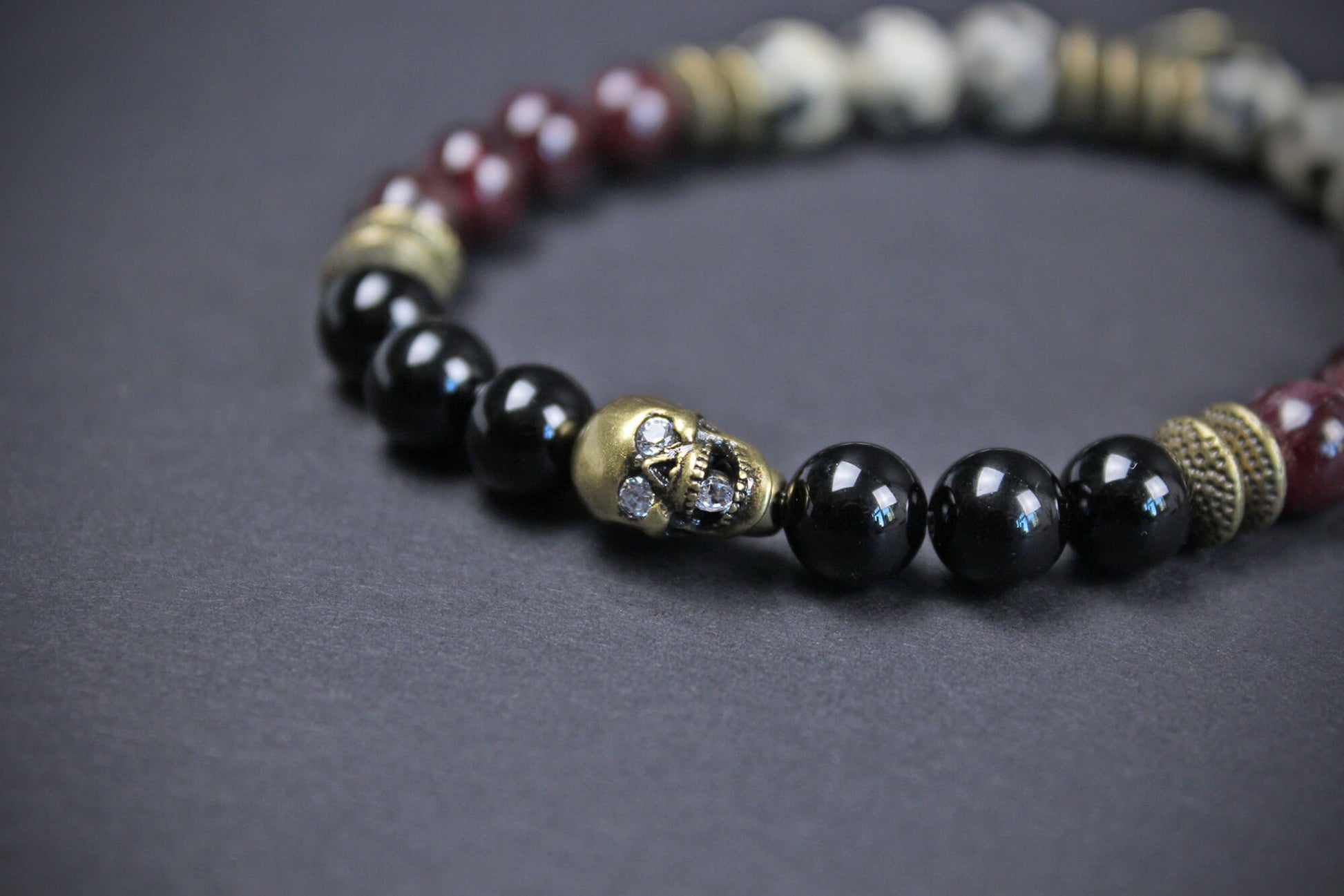 The Snake Eyes Bracelet - Black Onyx Red Garnet Dalmation Jasper Bronze Detailing Rock n Roll Pirate Style Unisex For Men And Women