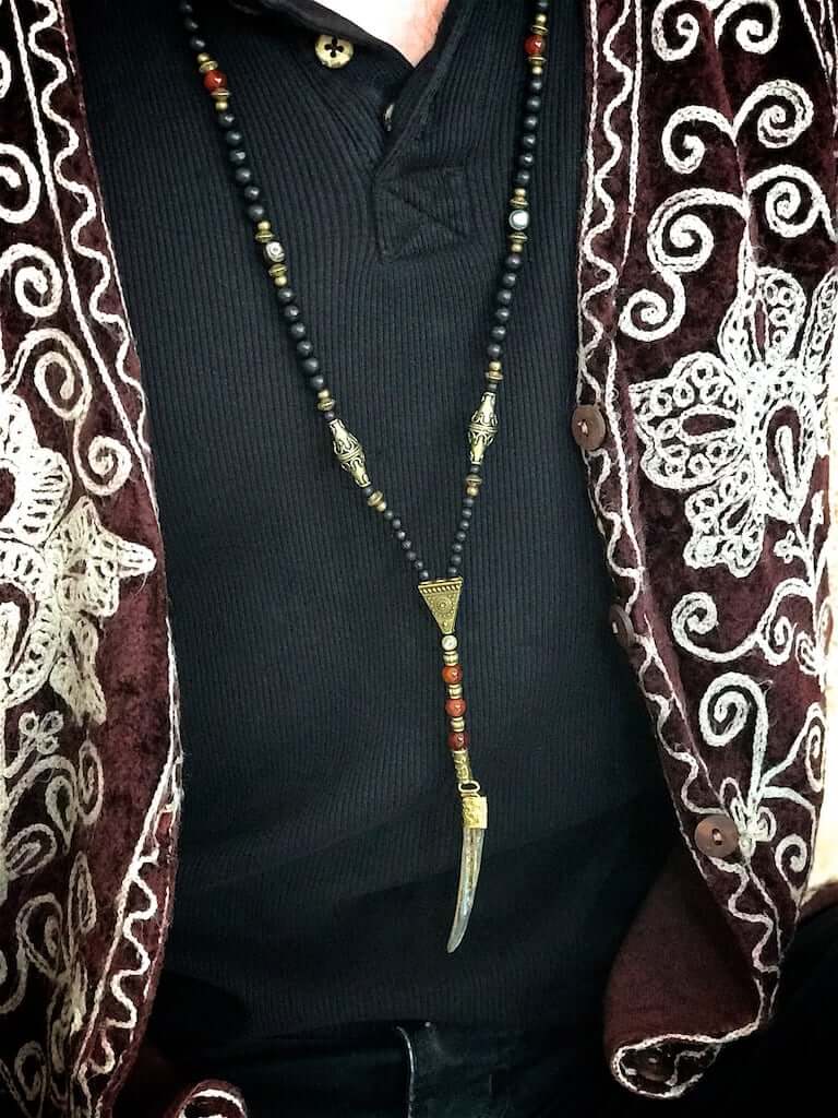 long beaded necklace with antique bronze detailing and wood beading