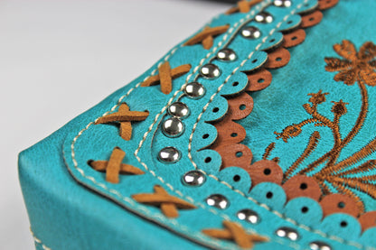 The Montana Shoulder Bag - turquoise & brown western cowgirl style bag with intricate detailing and cross motif with an internal zip pocket