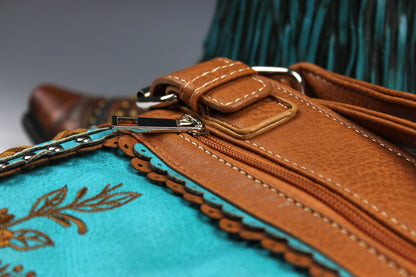 The Montana Shoulder Bag - turquoise & brown western cowgirl style bag with intricate detailing and cross motif with an internal zip pocket