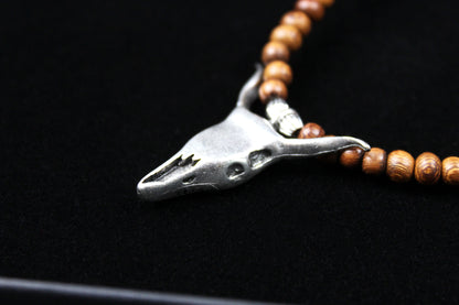 The Wyoming Necklace, Detailed with howlite, madre de cacao, blue/green tiger's eye and silver beading, all of this leading to a very cool ram's head pendant.