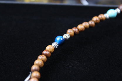 The Wyoming Necklace, Detailed with howlite, madre de cacao, blue/green tiger's eye and silver beading, all of this leading to a very cool ram's head pendant.