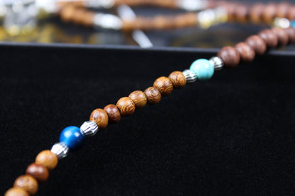 The Wyoming Necklace, Detailed with howlite, madre de cacao, blue/green tiger's eye and silver beading, all of this leading to a very cool ram's head pendant.