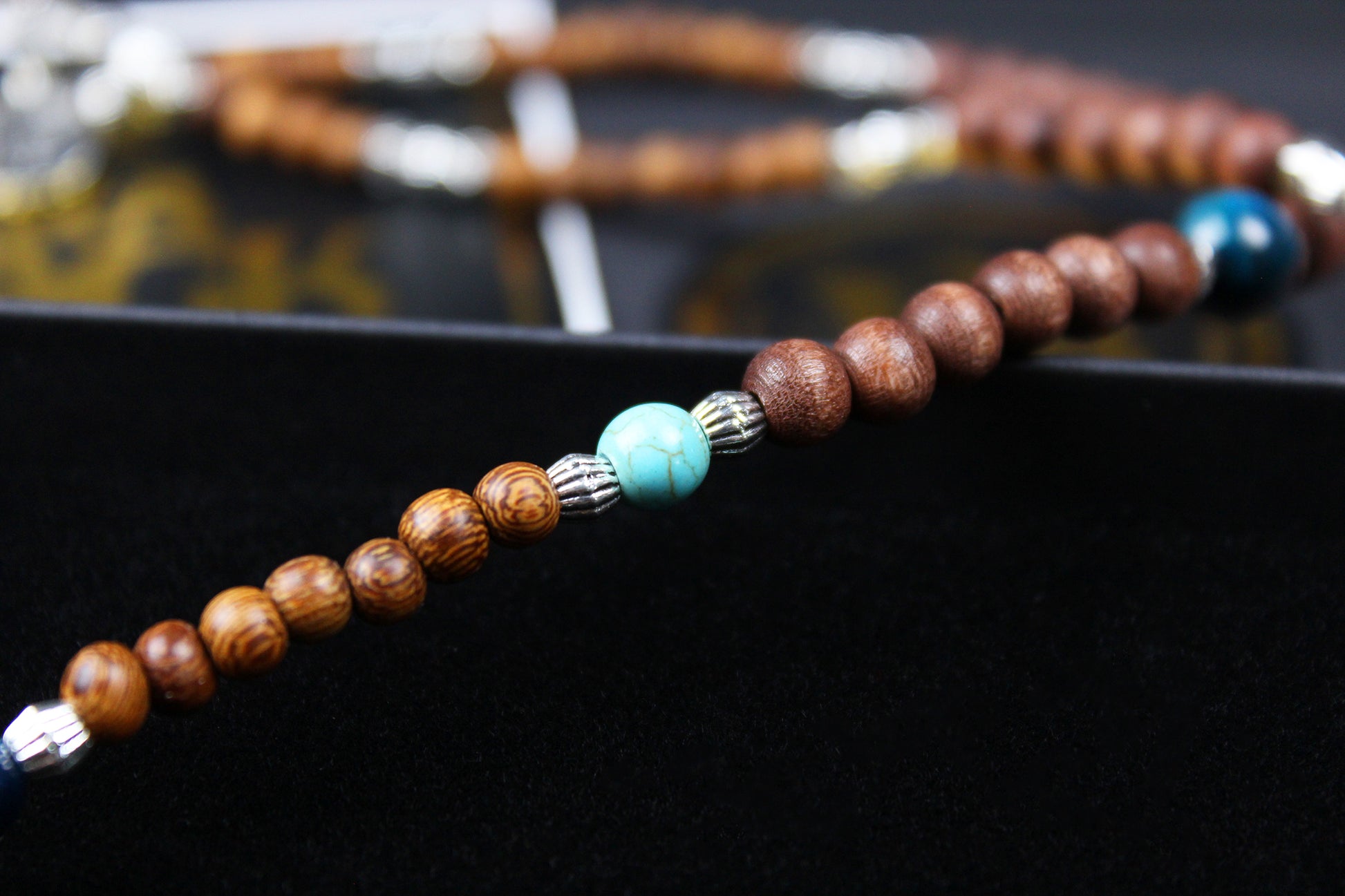 The Wyoming Necklace, Detailed with howlite, madre de cacao, blue/green tiger's eye and silver beading, all of this leading to a very cool ram's head pendant.