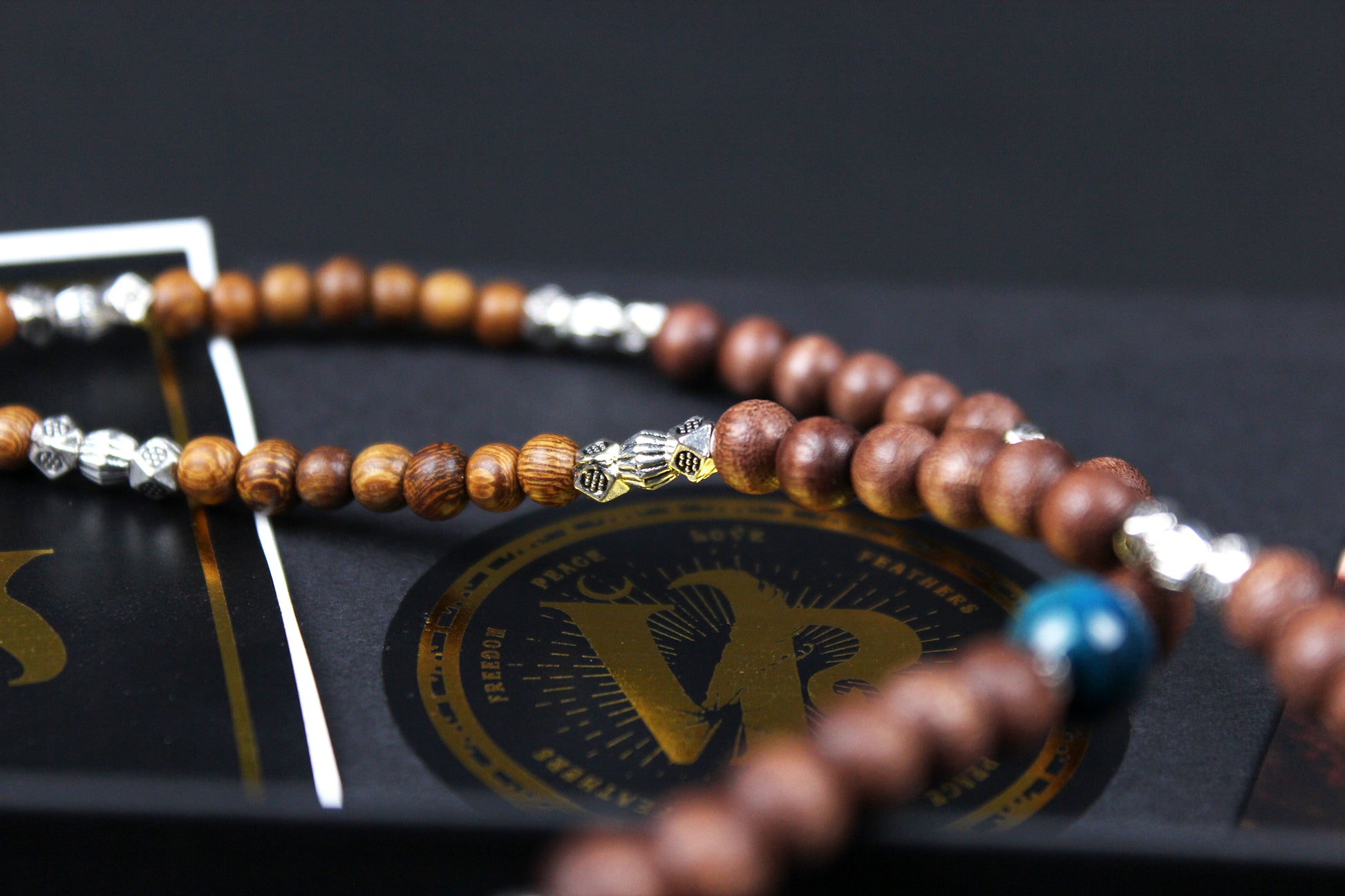 The Wyoming Necklace, Detailed with howlite, madre de cacao, blue/green tiger's eye and silver beading, all of this leading to a very cool ram's head pendant.
