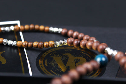 The Wyoming Necklace, Detailed with howlite, madre de cacao, blue/green tiger's eye and silver beading, all of this leading to a very cool ram's head pendant.