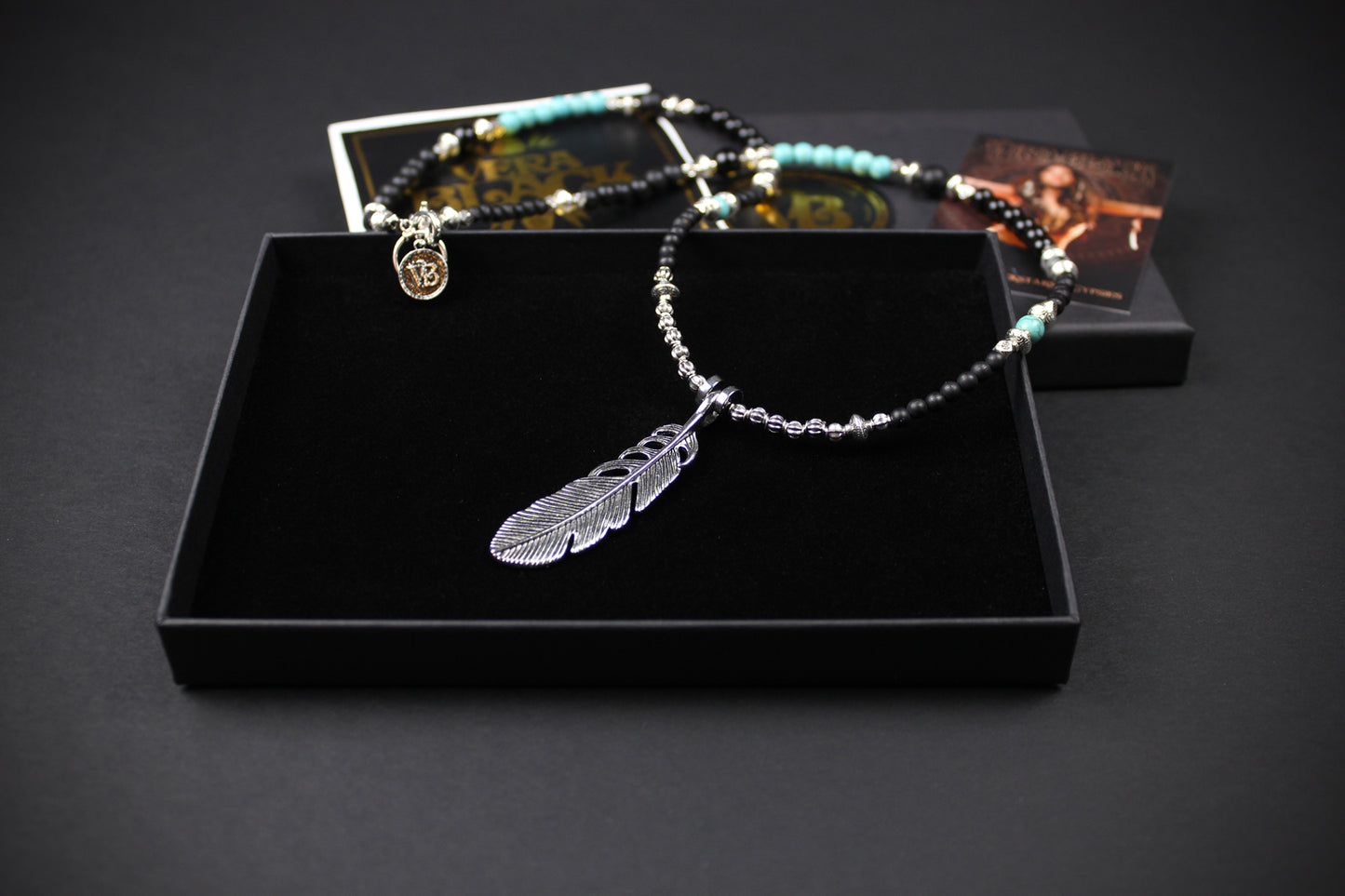 The Little Wing Necklace. Detailed with hematite, howlite, black wood beads and silver beading, all of this leading to a very cool feather pendant.