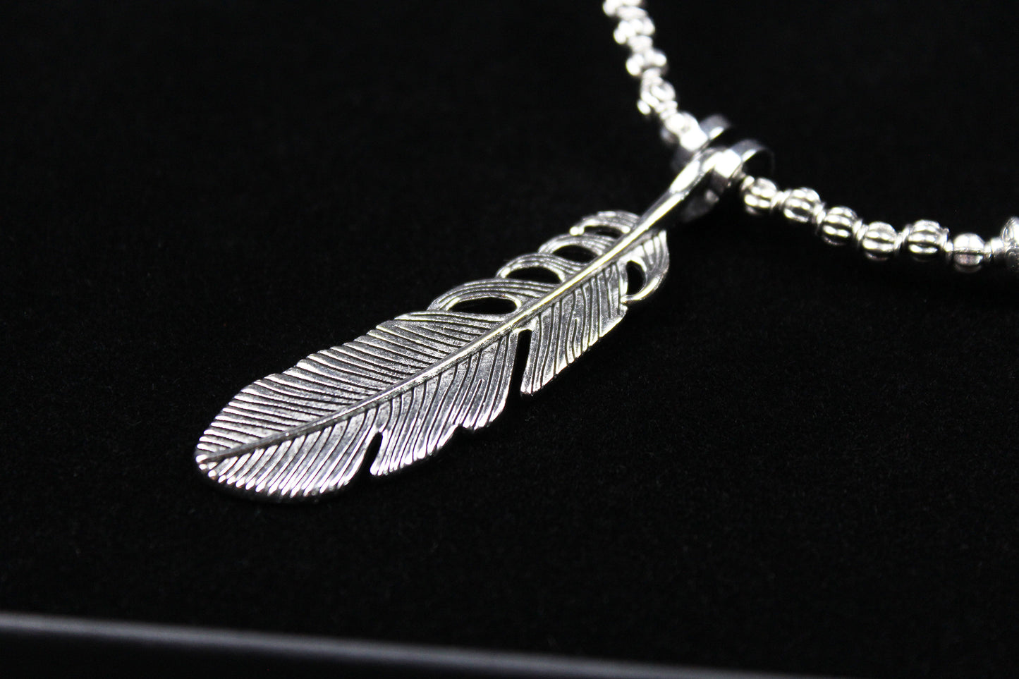 The Little Wing Necklace. Detailed with hematite, howlite, black wood beads and silver beading, all of this leading to a very cool feather pendant.