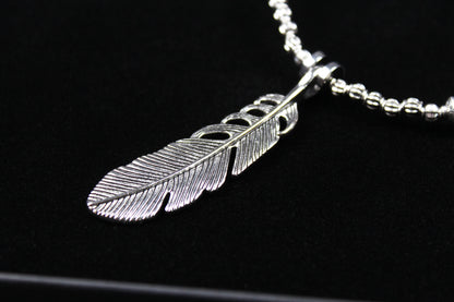 The Little Wing Necklace. Detailed with hematite, howlite, black wood beads and silver beading, all of this leading to a very cool feather pendant.