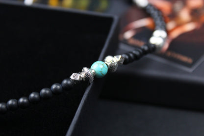 The Little Wing Necklace. Detailed with hematite, howlite, black wood beads and silver beading, all of this leading to a very cool feather pendant.
