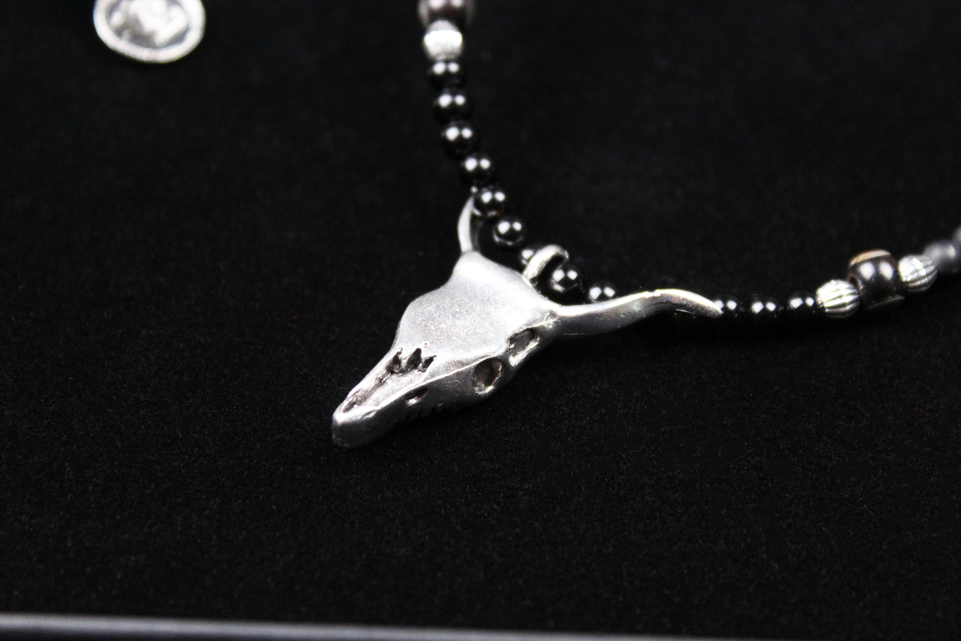 The Buffalo Smoke Necklace : Unisex Beaded Necklace Detailed with hematite, howlite, matte agate, lava stone, black onyx and silver beading, all of this leading to a very cool ram's head pendant.