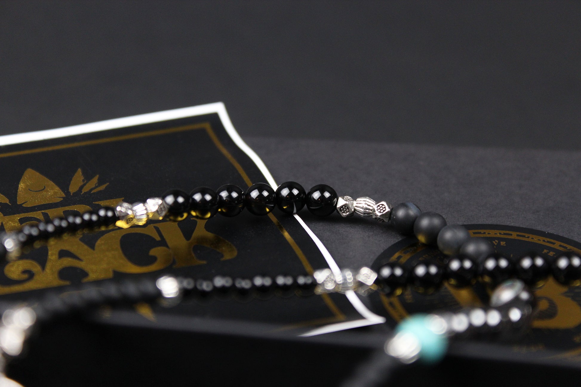 The Buffalo Smoke Necklace : Unisex Beaded Necklace Detailed with hematite, howlite, matte agate, lava stone, black onyx and silver beading, all of this leading to a very cool ram's head pendant.