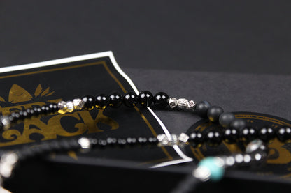The Buffalo Smoke Necklace : Unisex Beaded Necklace Detailed with hematite, howlite, matte agate, lava stone, black onyx and silver beading, all of this leading to a very cool ram's head pendant.