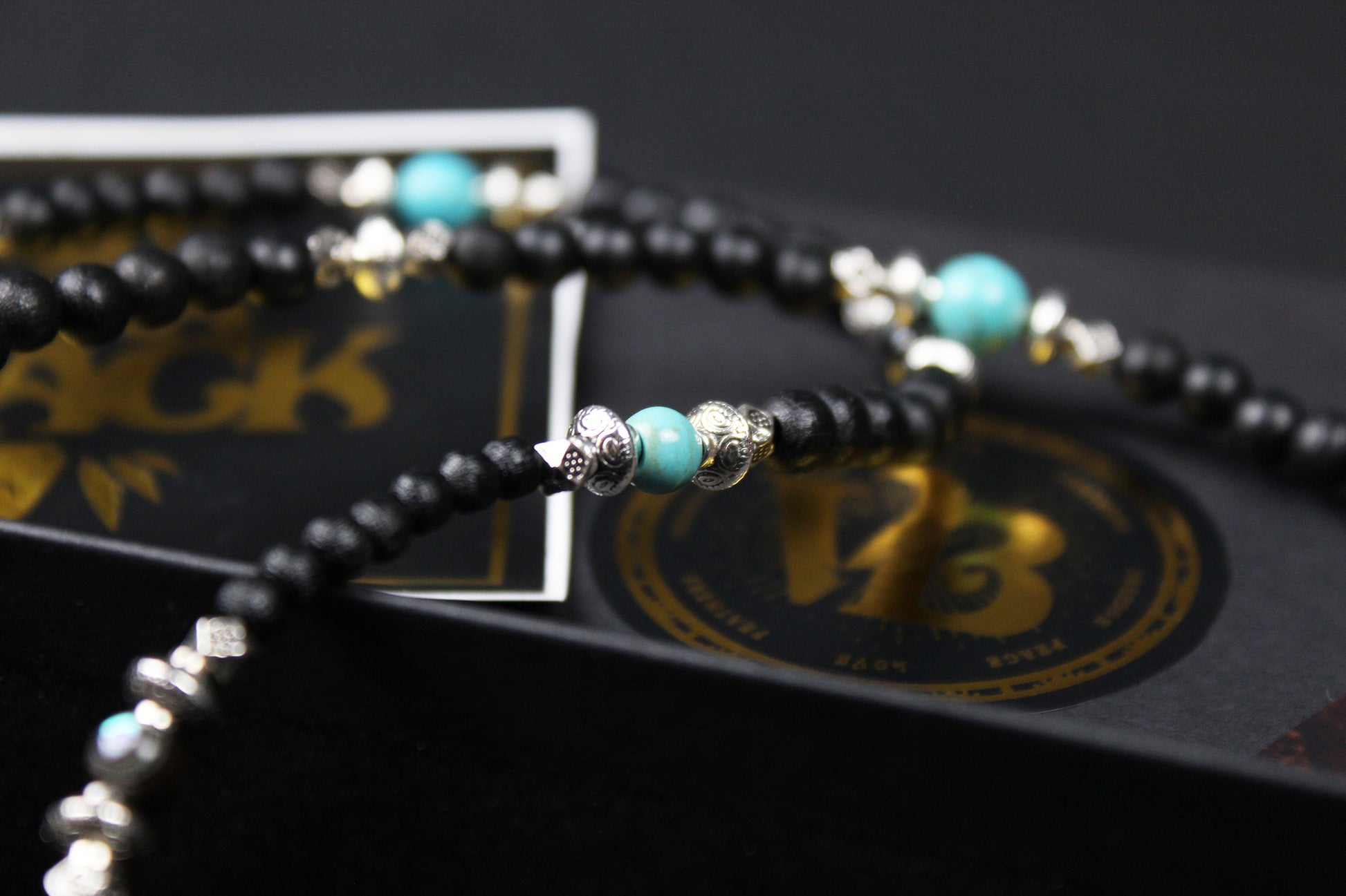 The Blue Wing Necklace, Detailed with hematite, howlite, black wood beads and silver beading, all of this leading to a very cool feather pendant.