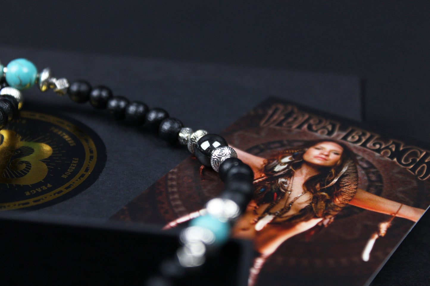 The Blue Wing Necklace, Detailed with hematite, howlite, black wood beads and silver beading, all of this leading to a very cool feather pendant.