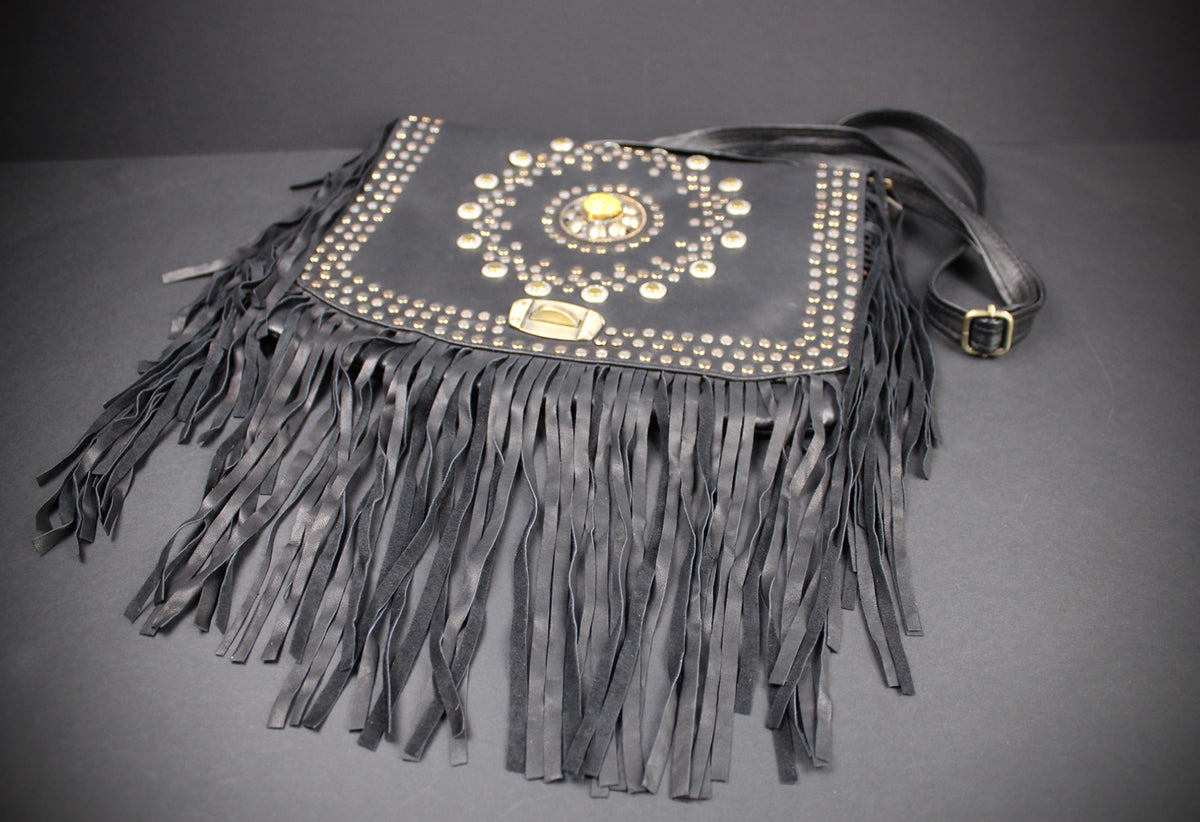 The Clover Bag : Black Edition, black goat leather shoulder bag with ornate detailing and adjustable strap.