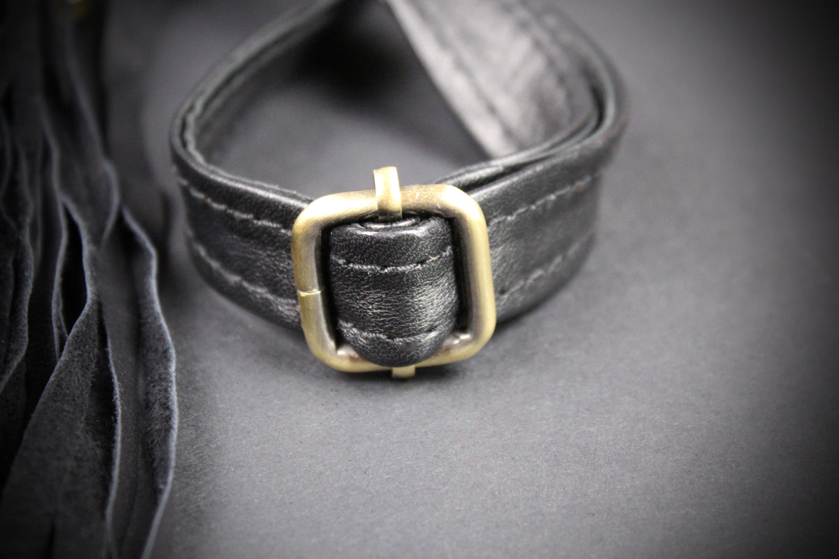 The Clover Bag : Black Edition, black goat leather shoulder bag with ornate detailing and adjustable strap.