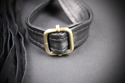 The Clover Bag : Black Edition, black goat leather shoulder bag with ornate detailing and adjustable strap.