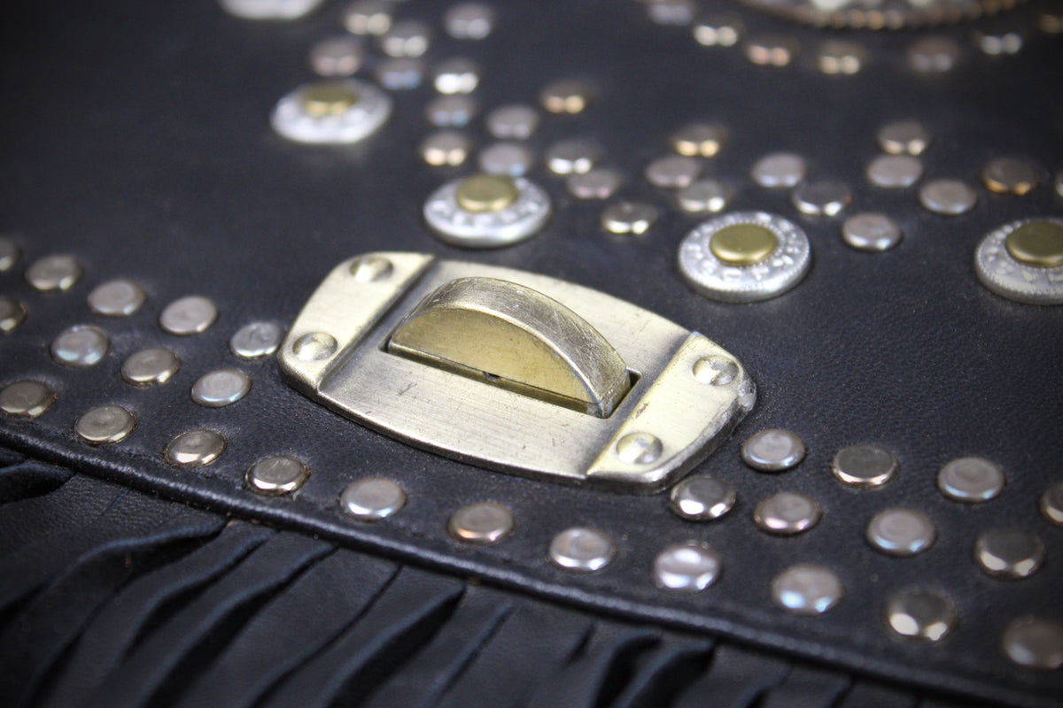 The Clover Bag : Black Edition, black goat leather shoulder bag with ornate detailing and adjustable strap.