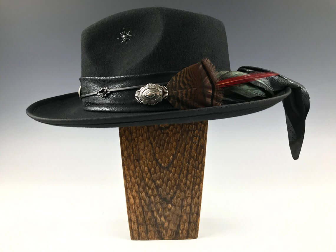 The Hombre Black Fedora Hat. Black wool felt fedora hat with a black leather look hat band with silver conchos and wild turkey with pheasant feather. rock n roll fedora hat.