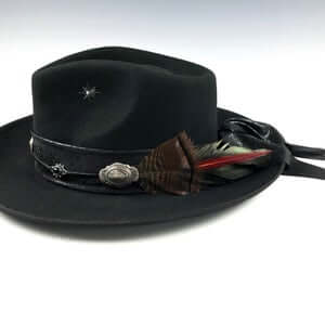 The Hombre Black Fedora Hat. Black wool felt fedora hat with a black leather look hat band with silver conchos and wild turkey with pheasant feather. rock n roll fedora hat.