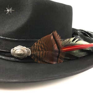 The Hombre Black Fedora Hat. Black wool felt fedora hat with a black leather look hat band with silver conchos and wild turkey with pheasant feather. rock n roll fedora hat.